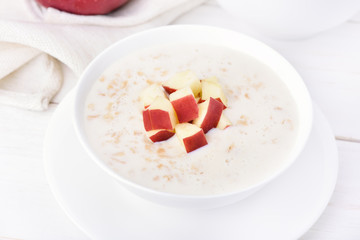 Porridge with red apple slices