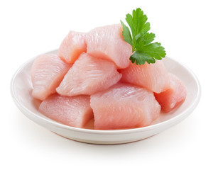 Raw chicken fillet. Small pieces of meat isolated on white.