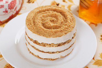 gentle honey cake with a dollop in still life sprinkling layers