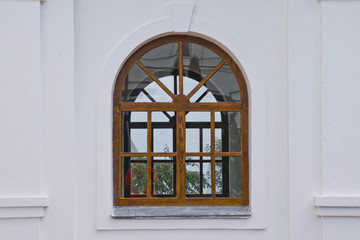 Fototapeta na wymiar window in a wooden frame of old manor