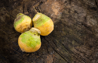 Fresh swedes on wooden background
