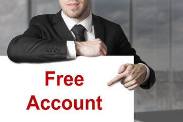 businessman pointing on sign free account