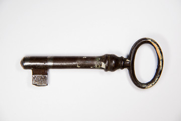 Vintage key to the safe on a white background