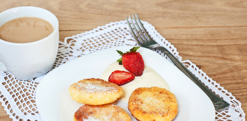 Breakfast of tasty round pancakes with cottage cheese with fragr