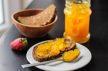 Sandwich with rye bread and orange jelly