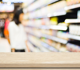 Empty table over blur supermarket background