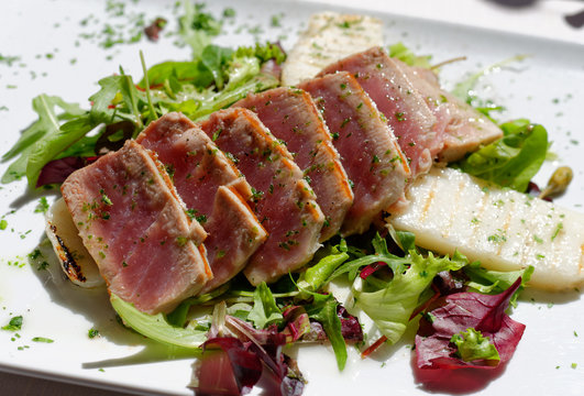 Appetizing slightly roasted tuna on  a salad