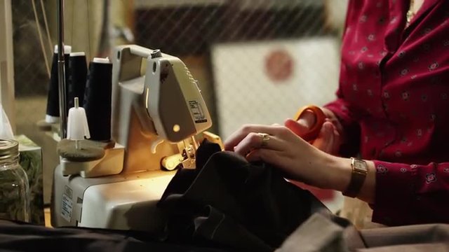 CU TU Young female fashion designer at work, mid section / Provo, Utah, USA