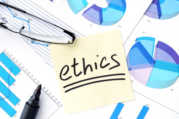 Papers with graphs and ethics business  concept.