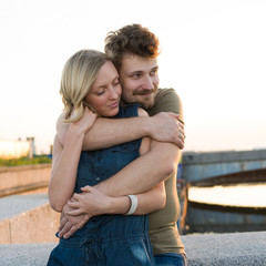 pretty couple embrace outdoor.