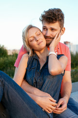 Obraz premium pretty couple embrace outdoor.