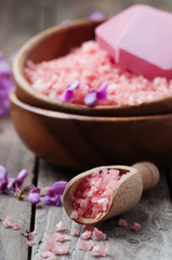 Spa concept with pink salt, soap and flowers