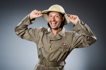 Funny safari hunter against background