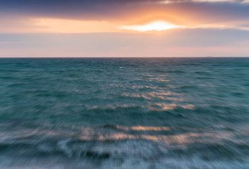 Blurred view of sunset across ocean