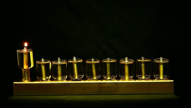 Beadle flame in Hanukia made of olive oil lanterns