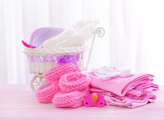 Baby accessories on table on light background