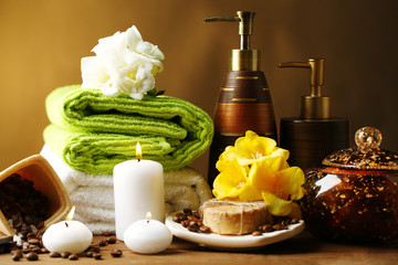 Composition of spa treatment on wooden table, on dark color background