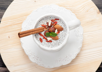 Chia seed pudding with nuts and goji berries. top view