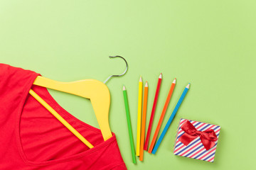 Red dress and gift box with pencils