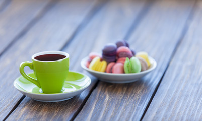 Fototapeta na wymiar Cup of coffee and macarons