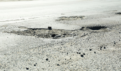 Very bad quality road with potholes