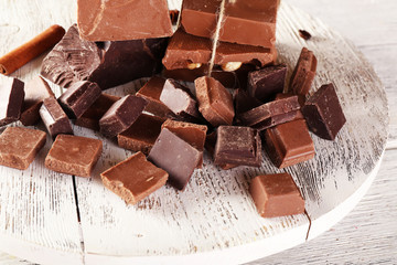 Set of chocolate on wooden table, closeup