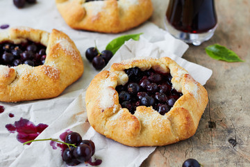 Homemade pie (galette) with black currant