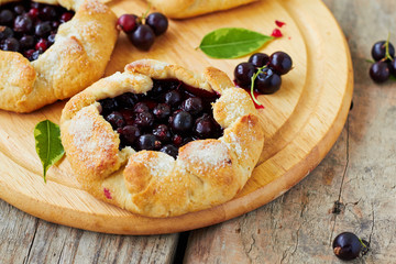 Homemade pie (galette) with black currant