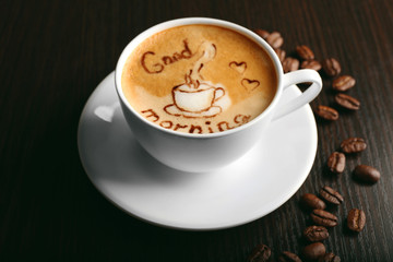 Cup of latte art coffee with grains, closeup