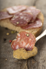 Salami in mustard sauce with seeds