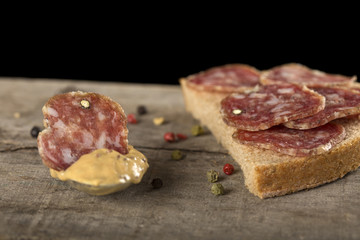 Slice of salami in mustard sauce