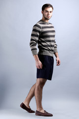 Man in casual style on gray background