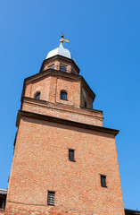 Fototapeta na wymiar Kokuy tower at the Novgorod Kremlin (Russia) against blue sky