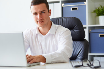 Young businessman working with laptop