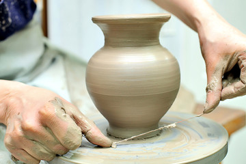 The creation of pottery. Hand painted. Handmade with clay.