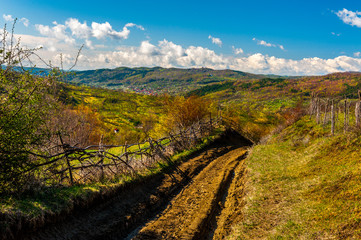 Dirt road in Romanian countryside landscape