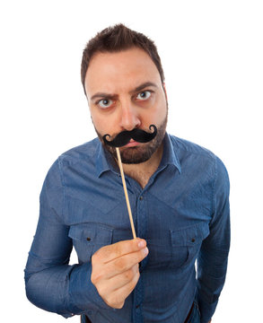 Young man with photo booth mustache
