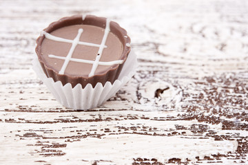 Dark chocolate on wooden background