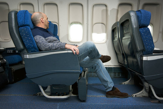 passenger sitting inside the plane of commercial airline