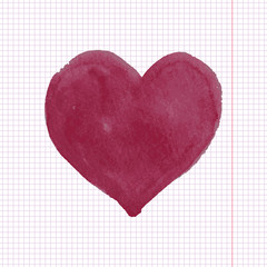 Red hand drawn watercolor heart on notebook background