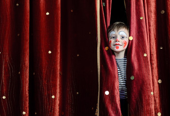 Boy Clown Peering Through Stage Curtains - obrazy, fototapety, plakaty