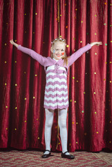 Young girl making her entrance on stage