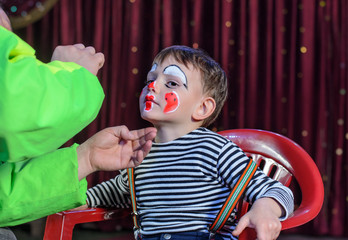 Young Boy Putting Mime Makeup for a Stage Play