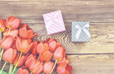 Tulips on Wooden Table with Little Gift Boxes