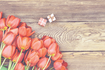 Tulips on Wooden Table with Little Gift Boxes