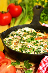Omelet with tomato,green onion and herbs.