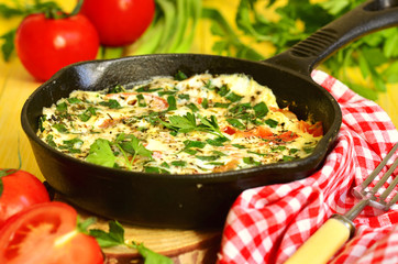 Omelet with tomato,green onion and herbs.