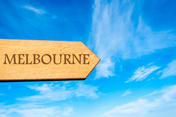 Wooden arrow sign pointing destination MELBOURNE, AUSTRALIA