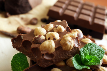 Chocolate with nuts, spices and mint, closeup