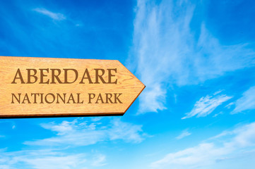 Wooden arrow sign pointing destination ABERDARE NATIONAL PARK